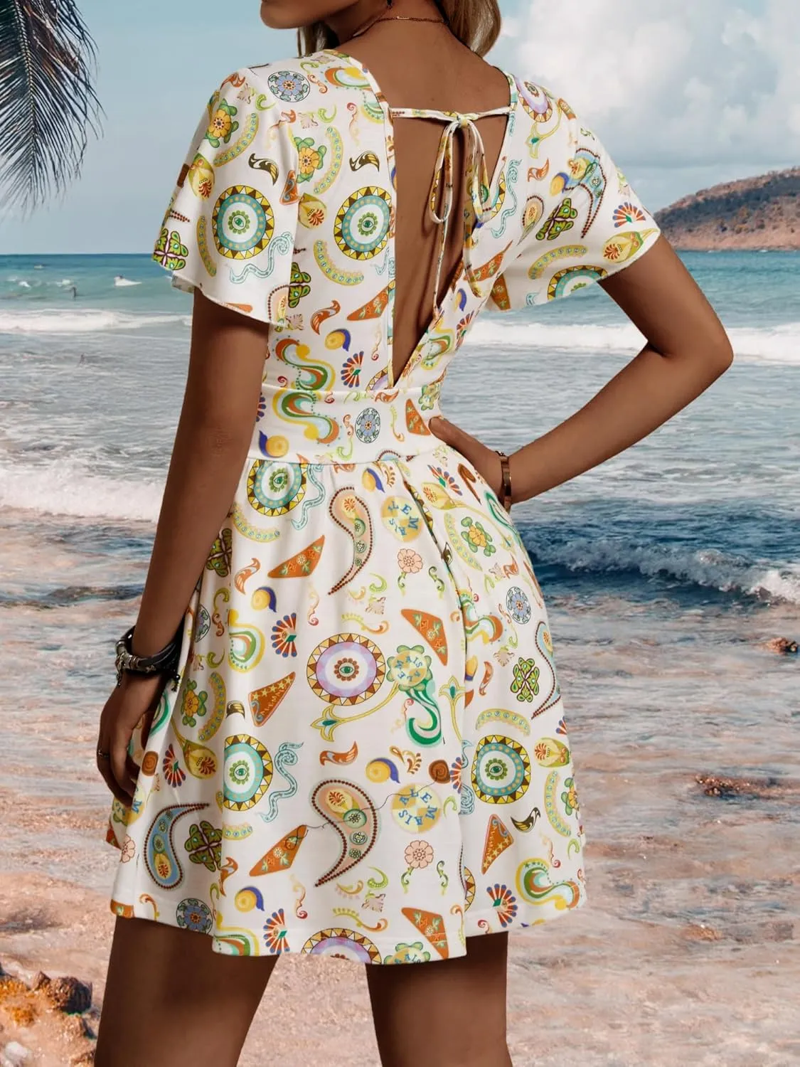 ZABERRY Women's Back Lace Up Floral Rompers with Pockets Short Ruffle Sleeve Summer Jumpsuits Wide leg Outfit